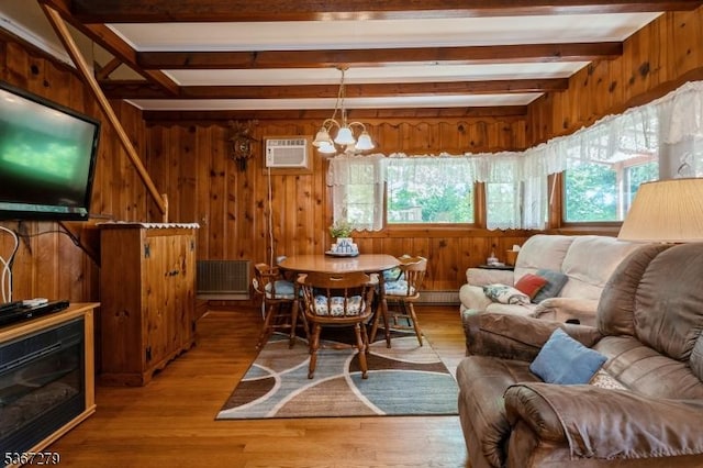 2 Hazelnut Dr, Hampton Twp, NJ 07860 - dining area featuring a chandelier, beamed ceiling, a wall mounted air conditioner, wooden walls, and light wood finished floors