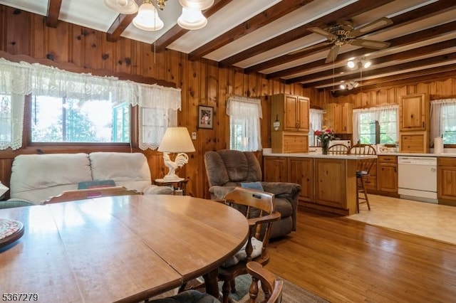 2 Hazelnut Dr, Hampton Twp, NJ 07860 - dining space with beam ceiling, wood walls, ceiling fan, light wood finished floors, and a chandelier