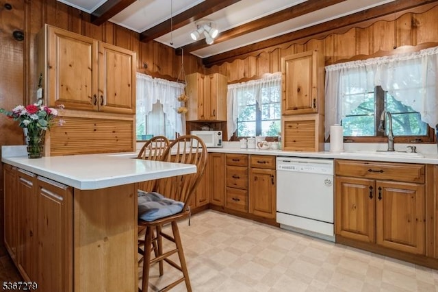 2 Hazelnut Dr, Hampton Twp, NJ 07860 - kitchen with white appliances, beamed ceiling, light flooring, a kitchen breakfast bar, and brown cabinets