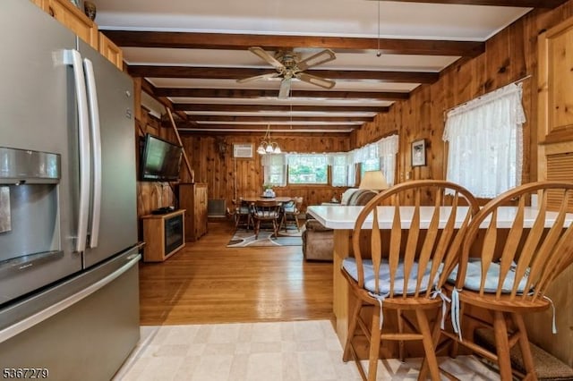 2 Hazelnut Dr, Hampton Twp, NJ 07860 - dining room with wood walls, beamed ceiling, ceiling fan, and light floors