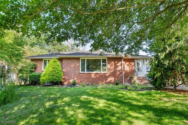 77 John E Busch Ave, Franklin Twp, NJ 08873 - ranch-style home with brick siding and a front lawn