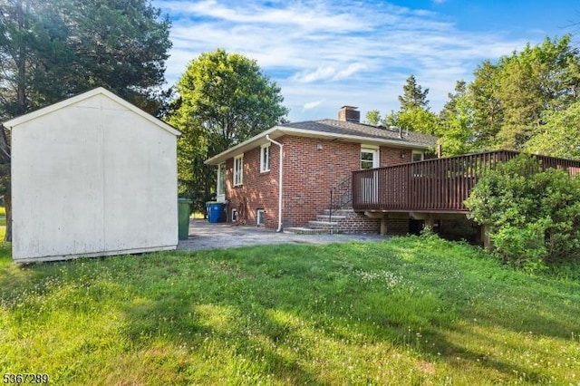 77 John E Busch Ave, Franklin Twp, NJ 08873 - back of property featuring brick siding, a lawn, a deck, a chimney, and a shed