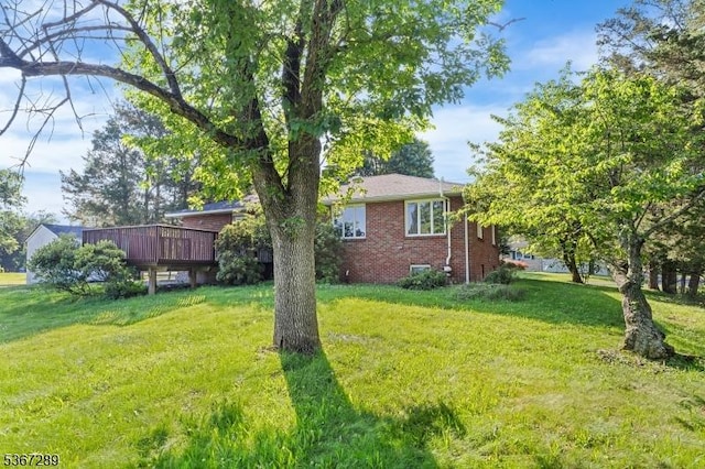 77 John E Busch Ave, Franklin Twp, NJ 08873 - view of grassy yard featuring a deck
