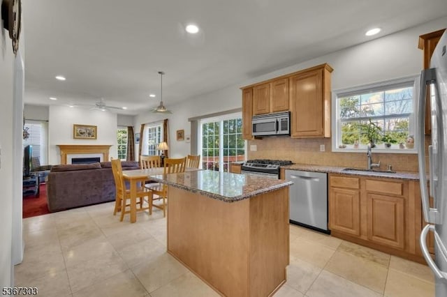 6 Bowers Dr, Allamuchy Twp, NJ 07840 - kitchen with stainless steel appliances, stone countertops, ceiling fan, tasteful backsplash, and a kitchen island