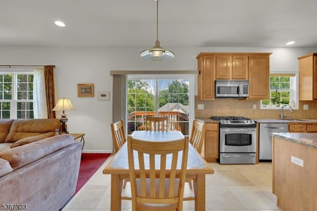 6 Bowers Dr, Allamuchy Twp, NJ 07840 - kitchen with appliances with stainless steel finishes, decorative backsplash, open floor plan, recessed lighting, and light tile patterned flooring