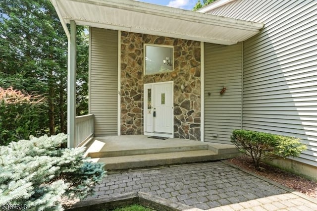 129 W Lake Shore Dr, Rockaway Twp, NJ 07866 - view of exterior entry featuring stone siding