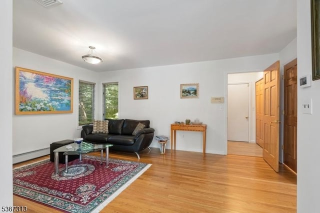 129 W Lake Shore Dr, Rockaway Twp, NJ 07866 - living room with a baseboard heating unit and light wood-style floors