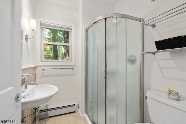 129 W Lake Shore Dr, Rockaway Twp, NJ 07866 - bathroom with a stall shower, a baseboard radiator, and tile patterned flooring