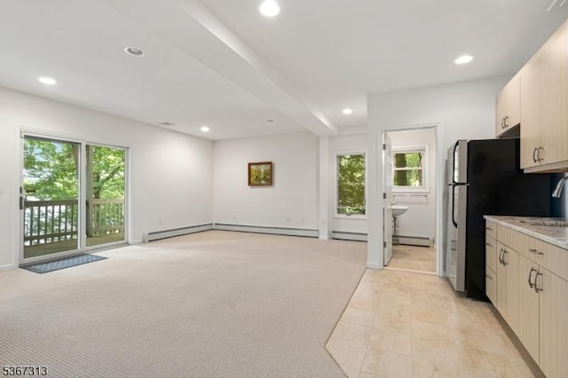 129 W Lake Shore Dr, Rockaway Twp, NJ 07866 - kitchen featuring recessed lighting, a baseboard radiator, light stone countertops, open floor plan, and freestanding refrigerator
