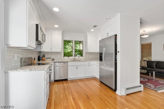 129 W Lake Shore Dr, Rockaway Twp, NJ 07866 - kitchen with stainless steel appliances, baseboard heating, light wood-type flooring, white cabinets, and recessed lighting