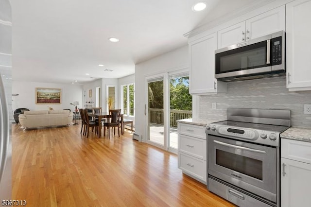 129 W Lake Shore Dr, Rockaway Twp, NJ 07866 - kitchen with appliances with stainless steel finishes, backsplash, white cabinetry, light wood-style floors, and recessed lighting