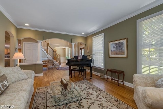 3 Mackenzie Ct, Sparta Twp, NJ 07871 - living area with arched walkways, decorative columns, stairway, healthy amount of natural light, and recessed lighting