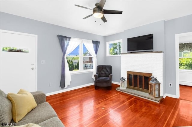 7 Park Ave, Summit City, NJ 07901 - living area featuring wood finished floors, a ceiling fan, and a brick fireplace