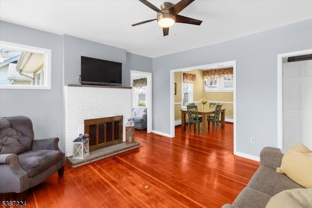 7 Park Ave, Summit City, NJ 07901 - living room featuring ceiling fan, wood finished floors, and a brick fireplace