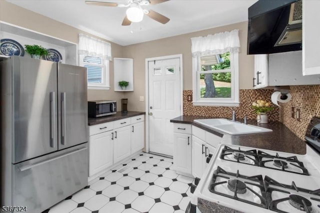 7 Park Ave, Summit City, NJ 07901 - kitchen featuring appliances with stainless steel finishes, extractor fan, ceiling fan, dark countertops, and light flooring