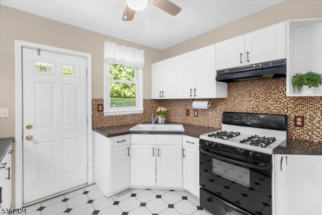 7 Park Ave, Summit City, NJ 07901 - kitchen featuring white range with gas stovetop, under cabinet range hood, dark countertops, white cabinetry, and ceiling fan