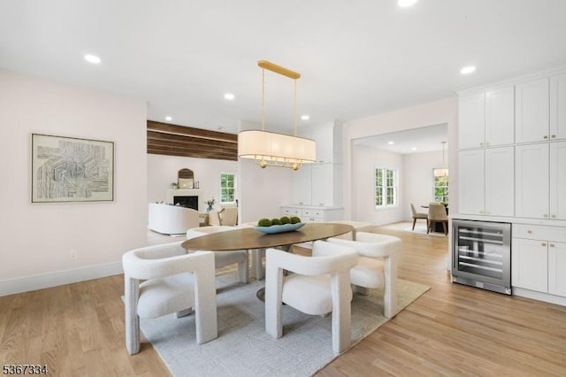 211 Spencer Rd, Bernards Twp, NJ 07920 - dining room with wine cooler, plenty of natural light, light wood finished floors, recessed lighting, and beamed ceiling