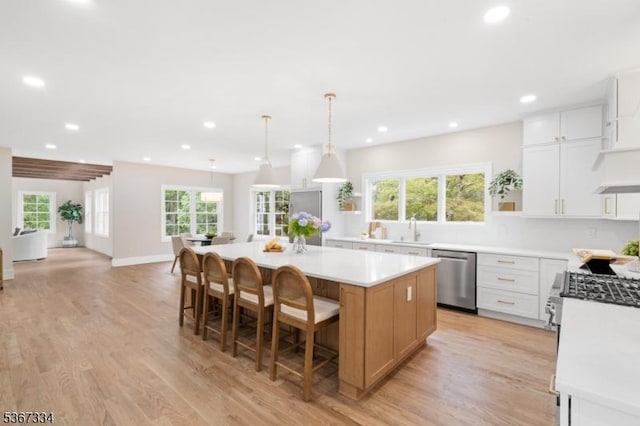 211 Spencer Rd, Bernards Twp, NJ 07920 - kitchen with stainless steel dishwasher, a center island, recessed lighting, light countertops, and light wood-style flooring