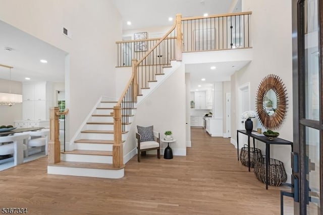211 Spencer Rd, Bernards Twp, NJ 07920 - entrance foyer featuring a high ceiling, stairs, wood finished floors, and recessed lighting