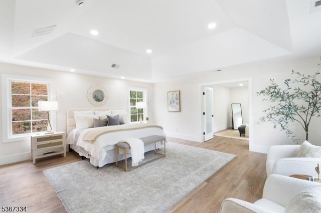211 Spencer Rd, Bernards Twp, NJ 07920 - bedroom featuring a tray ceiling, light wood-style flooring, and recessed lighting