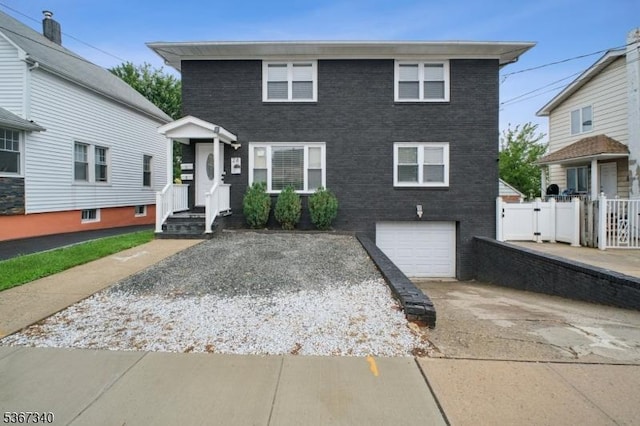 28 Sanford Ave, Belleville Twp, NJ 07109 - view of front of house featuring driveway, a garage, and brick siding