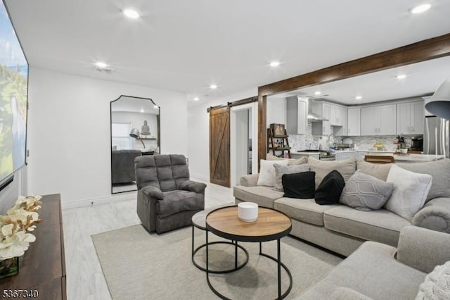 28 Sanford Ave, Belleville Twp, NJ 07109 - living area with a barn door, recessed lighting, and light wood-type flooring