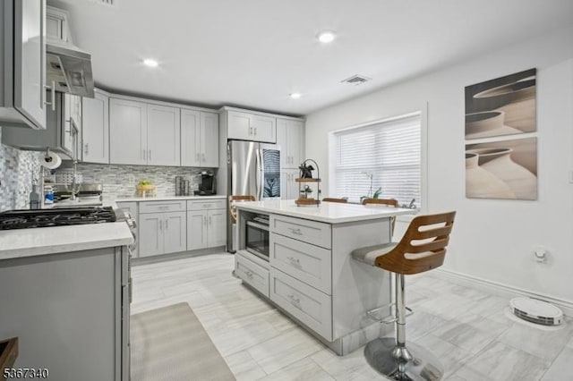28 Sanford Ave, Belleville Twp, NJ 07109 - kitchen featuring appliances with stainless steel finishes, gray cabinetry, light countertops, tasteful backsplash, and recessed lighting