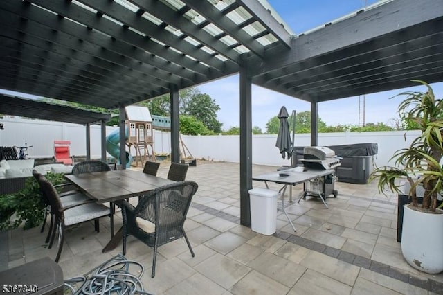 28 Sanford Ave, Belleville Twp, NJ 07109 - fenced backyard with a playground, a pergola, a patio area, and outdoor dining space