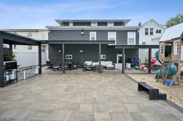 28 Sanford Ave, Belleville Twp, NJ 07109 - back of house featuring a patio area, an outdoor hangout area, and brick siding