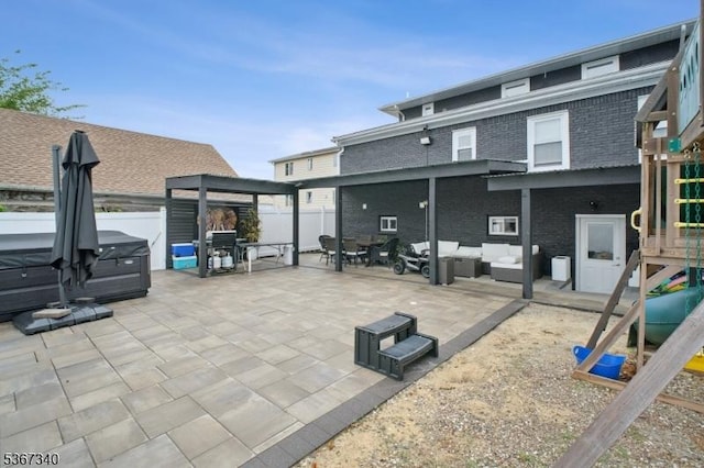 28 Sanford Ave, Belleville Twp, NJ 07109 - rear view of house with a hot tub, an outdoor hangout area, a patio area, a fenced backyard, and brick siding