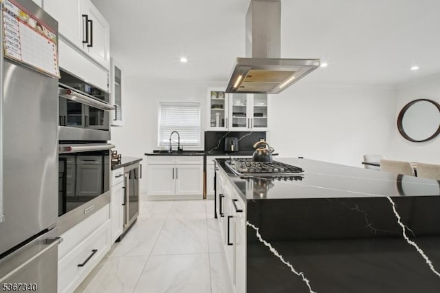 28 Sanford Ave, Belleville Twp, NJ 07109 - kitchen featuring appliances with stainless steel finishes, island range hood, dark countertops, light marble finish floors, and recessed lighting