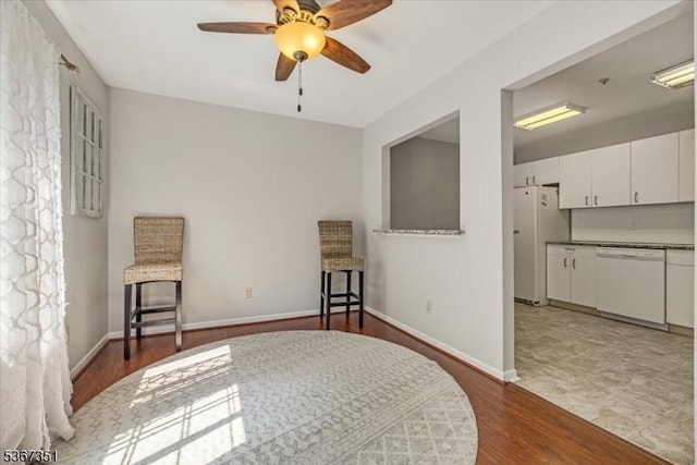 81 Village Dr Unit 81, Morris Twp, NJ 07960 - bedroom with freestanding refrigerator, dark wood-style floors, and ceiling fan