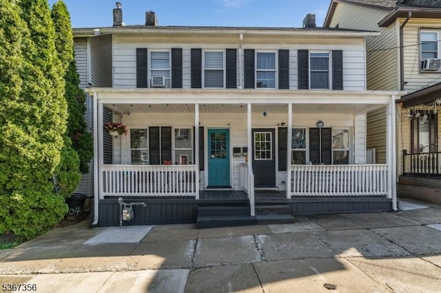 302 Chambers St, Phillipsburg Town, NJ 08865 - view of property with a porch and a chimney