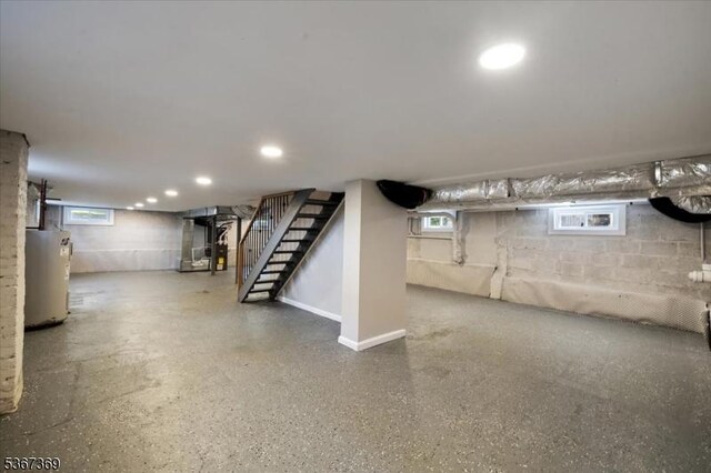 29 S Hillside Ave, Roxbury Twp, NJ 07876 - below grade area featuring electric water heater, stairway, and recessed lighting
