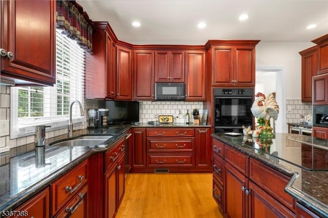 3 Stanbury Ln, Kingwood Twp, NJ 08825 - kitchen with reddish brown cabinets, black appliances, backsplash, light wood-style floors, and recessed lighting
