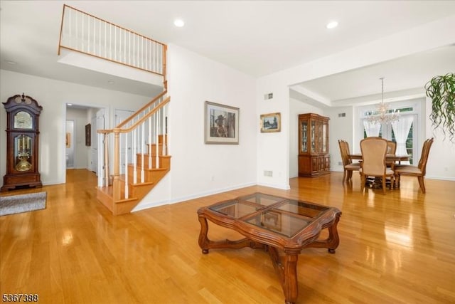 3 Stanbury Ln, Kingwood Twp, NJ 08825 - living room with a chandelier, wood finished floors, recessed lighting, and stairs