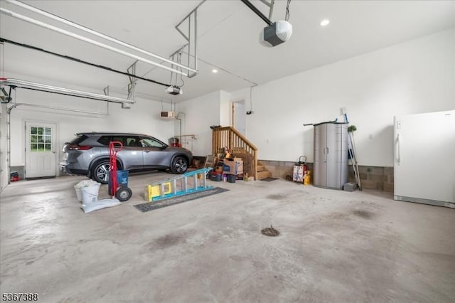 3 Stanbury Ln, Kingwood Twp, NJ 08825 - garage with freestanding refrigerator and a garage door opener