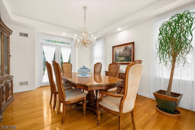 3 Stanbury Ln, Kingwood Twp, NJ 08825 - dining room featuring light wood finished floors, a chandelier, a raised ceiling, and recessed lighting