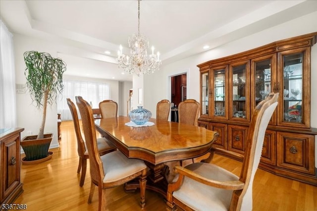 3 Stanbury Ln, Kingwood Twp, NJ 08825 - dining space featuring a tray ceiling, light wood-style floors, recessed lighting, and a chandelier