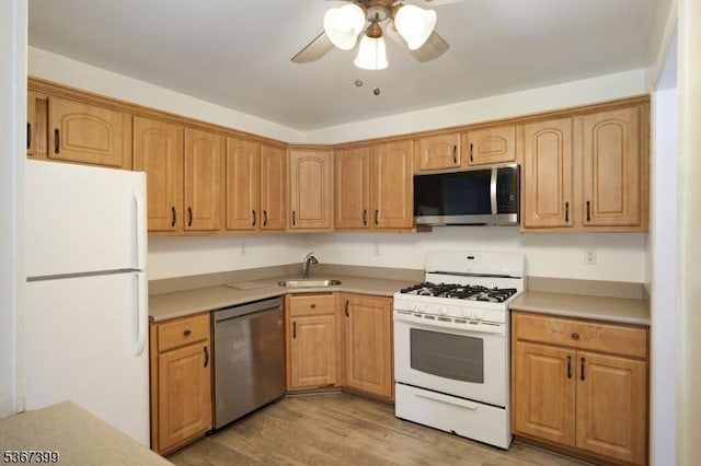 136 Woodward Ln, Bernards Twp, NJ 07920 - kitchen featuring stainless steel appliances, ceiling fan, light wood-style flooring, and light countertops