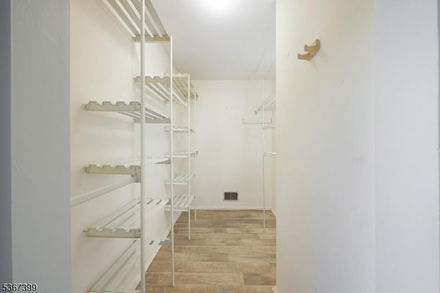 136 Woodward Ln, Bernards Twp, NJ 07920 - walk in closet featuring wood finished floors