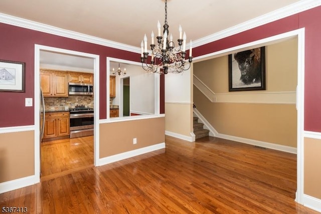 29F Concord Rd Unit F, West Milford Twp, NJ 07480 - unfurnished dining area featuring a chandelier, stairway, wood finished floors, and crown molding