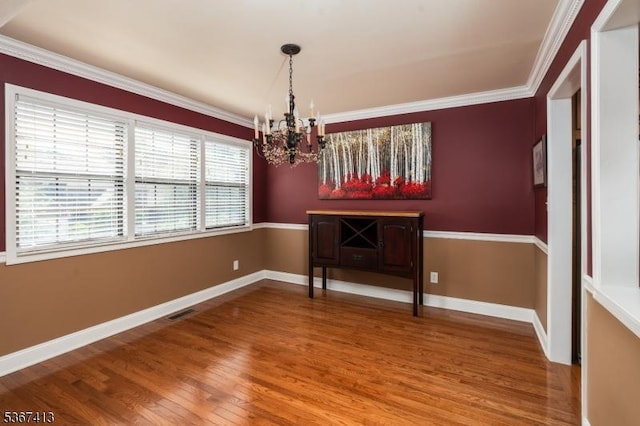 29F Concord Rd Unit F, West Milford Twp, NJ 07480 - unfurnished dining area featuring a chandelier, wood finished floors, and crown molding