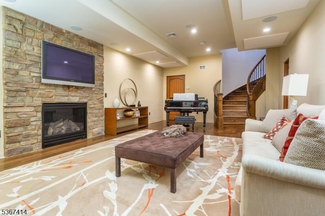 39 Crescent Dr, Morris Twp, NJ 07960 - living area featuring stairway, light wood-style flooring, a stone fireplace, and recessed lighting