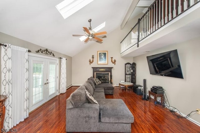 14 Windjammer Dr, Jefferson Twp, NJ 07849 - living area featuring a skylight, high vaulted ceiling, wood finished floors, a glass covered fireplace, and ceiling fan