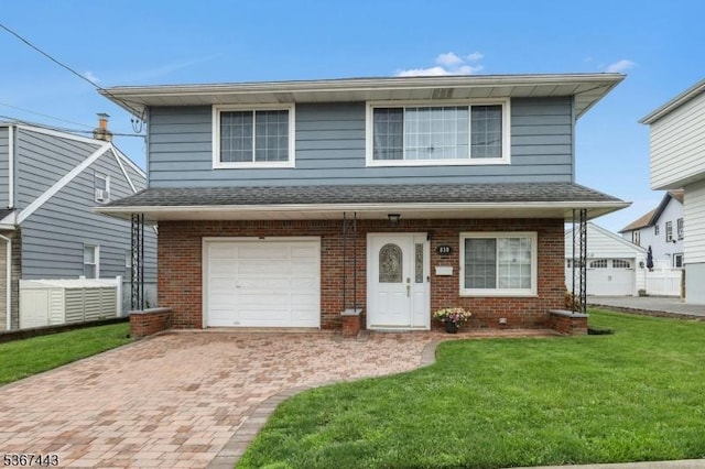 830 Pennsylvania Ave, Lyndhurst Twp, NJ 07071 - view of front of home featuring brick siding, a front yard, decorative driveway, and an attached garage