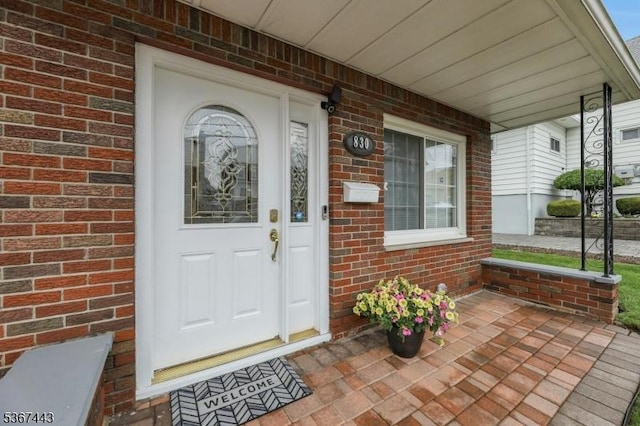 830 Pennsylvania Ave, Lyndhurst Twp, NJ 07071 - doorway to property with covered porch and brick siding