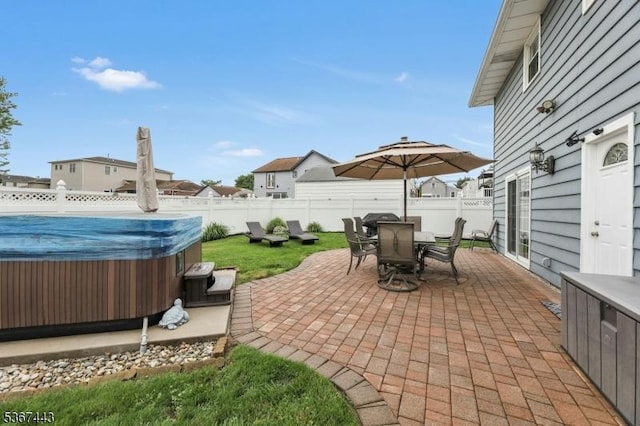 830 Pennsylvania Ave, Lyndhurst Twp, NJ 07071 - fenced backyard featuring a hot tub, outdoor dining space, a patio area, and a residential view