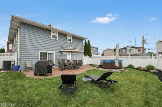 830 Pennsylvania Ave, Lyndhurst Twp, NJ 07071 - back of property featuring a hot tub, a fenced backyard, and a patio