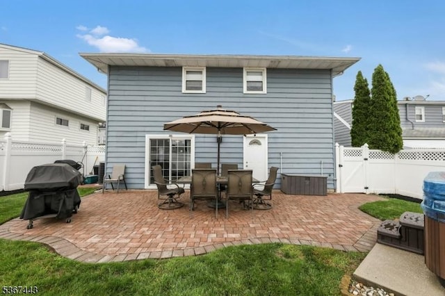 830 Pennsylvania Ave, Lyndhurst Twp, NJ 07071 - rear view of house with a patio area, a fenced backyard, and a gate